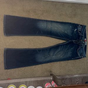 Buckle low rise madison jeans